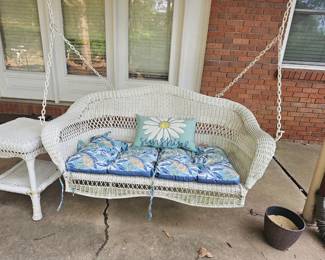 Wicker swing and table
55"W x 29"D x 25"T

Table: 16"x16" 21"T