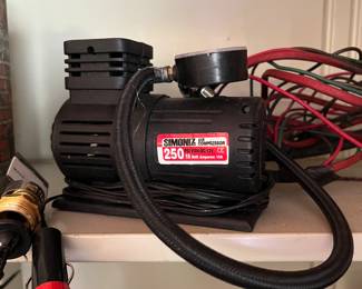 Tire air pump with cigarette lighter attachment 