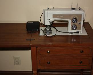 Sears Kenmore sewing machine in cabinet