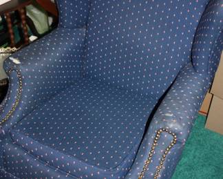 Blue recliner (arms worn)