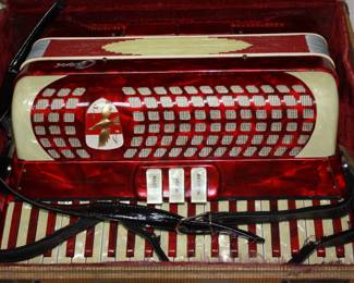 Red Capri Accordion in original case. Plays beautifully