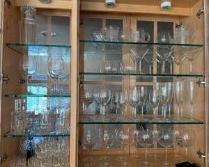 Clear Glass Drinkware Set Including Wine Glasses, Martini Glasses, Tumblers, and Pitchers in Wooden Cabinet