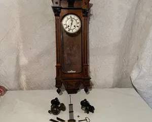 Vintage Wooden Wall Clock with Roman Numerals and Decorative Columns