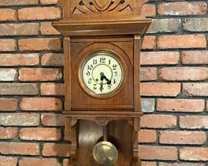 Vintage Wooden Wall Clock with Brass Pendulum and Decorative Carving