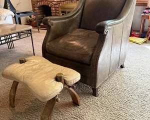 Vintage Brown Leather Club Chair with Studded Trim and Beige Leather Footstool with Wooden Legs