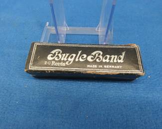 Lot 249. Ands Koch Bugle Band Artist 10-hole tremolo harmonica in the key of C. Sounds great. Box in VGC.