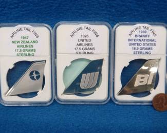 Lot 413. Sterling silver airline tailfins. 51.9 total grams.