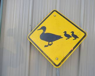 Lot 406. Duck Crossing metal sign and pole