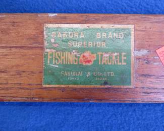 Lot 102. Vintage wooden Sakura Brand Superior Fishing Tackle collapsible fishing rod in a wooden box with built-in storage full of old flies.