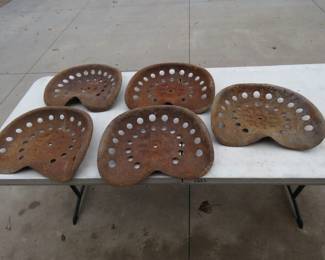 Lot 172. Five old tractor seats