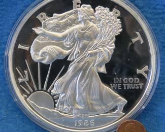 Lot 17. 1986 American Silver Eagle replica containing one half pound of .999 fine silver