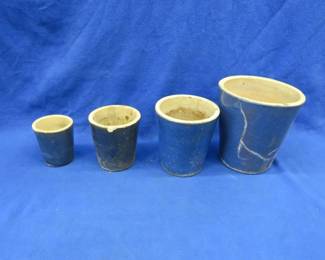 Lot 320. Three clay flower pots in as shown condition