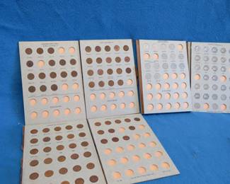 Lot 329. Canadian Nickel and penny albums are in poor condition, with coins: Nickels from 1922 through 1989. Pennies from 1920 through 1913.