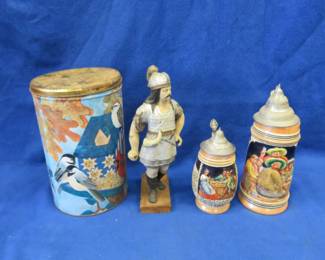 Lot 68. Two German steins, a metal tin, and more