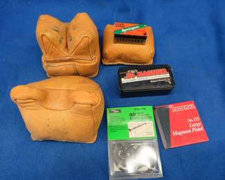 Lot 168. Leather shooting pads, a few primers, 50 Remington 22LR rounds, and more