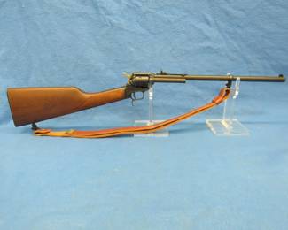 Lot 9.  Heritage Rough Rider revolver rifle. Ser. #3PH172136. Includes 22 LR and 22 WMR cylinders and a case.