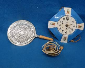 Lot 342. Grease deflector, lamp socket, and a clock for parts or repair