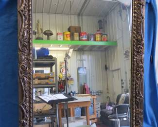 Lot 131. Heavy 29" x 41" beveled mirror in a plastic gilded frame in excellent condition, and one smaller mirror