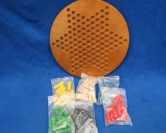 Lot 186. Wooden Chinese checkers gameboard and pegs