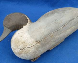 Lot 33. Wooden decoy with no eyes