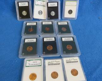 Lot 87. Thirteen encapsulated Lincoln pennies from 1943-1991 most of which are INB MS 69 or DCAM proof 70, including two off-center strikes