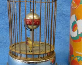 Lot 16. Working wind-up clock with an animated bird and turning globe