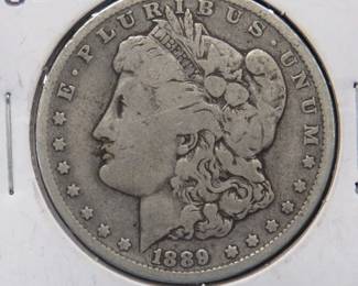 Lot 14. 1889 O Morgan silver dollar