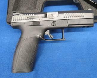 Lot 25. CZ-USA P-10 9mm semi-auto pistol. S/N: H051257. Two magazines, extra back straps, and original case cc