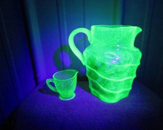 Lot 279. Uranium glass pitcher and cup and more