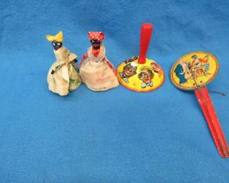 Lot 314. Black Americana items including two noisemakers and two bells