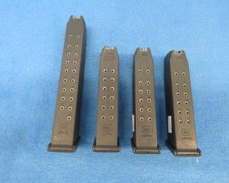 Lot 213. Four Glock 40 magazines