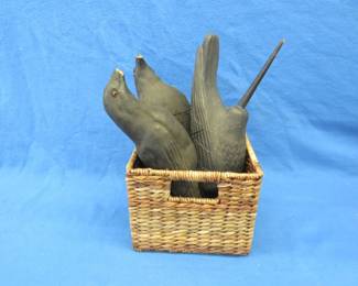 Lot 268. Three crow decoys in a wicker basket. Two have glass eyes and damaged beaks. 