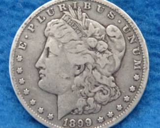 Lot 414. 1899 O Morgan silver dollar