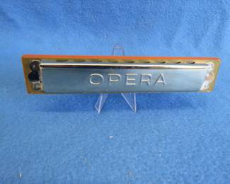 Lot 106. Koestler Opera tremolo 32-hole harmonica in the key of C. Sounds great. Box in good condition, missing a flap.
