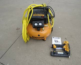 Lot 201. Bostitch 6-gallon 165 PSI air compressor with a Bostitch 18-gauge brad nailer. Both are in like-new condition.