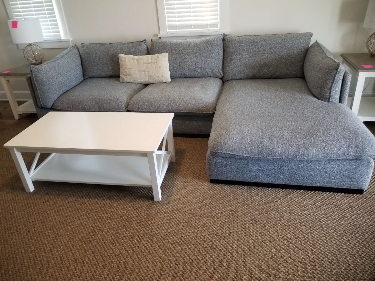 Cozy sectional couch with chaise; coffee table