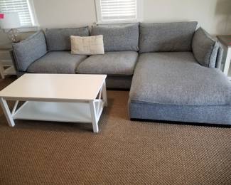 Cozy sectional couch with chaise; coffee table