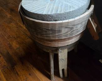 Early grinding wheel made into a primitive stand