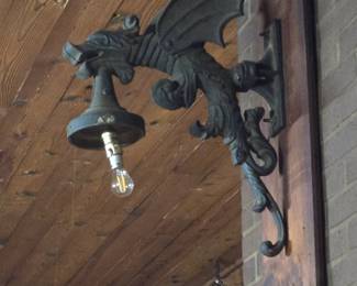 Pair metal winged Griffon wall lights.