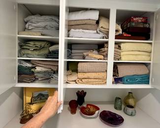 tons of linens, cleaning products, kitchen