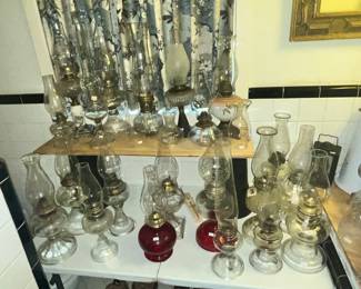 A SMALL ROOM FILLED WITH MANY OIL LAMPS!