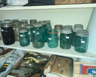 LOTS OF OLD MASON JARS INSIDE AND OUTSIDE