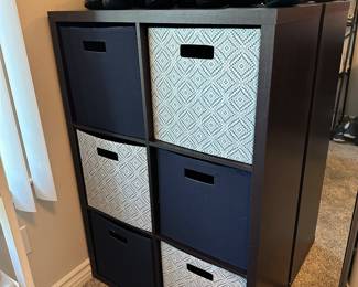 Six compartment shelf can be used with or without the fabric pull out bins either upright or on its side