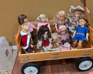 American Girl dolls out for a stroll in their handmade wagon. Wagon is for sale!