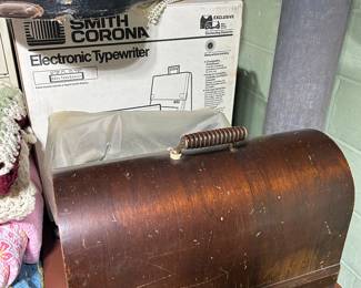 Smith Corona typewriter and two portable sewing machines.