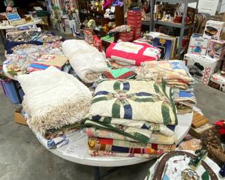 lots of quilts and chenille blankets