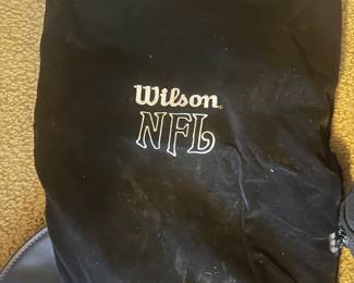 black drawstring bag with the "Wilson NFL" logo printed on it