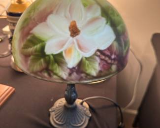 vintage Tiffany-style table lamp with a hand-painted glass shade featuring a magnolia flower design