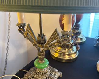vintage Art Deco brass table lamp with a green accent and a pleated shade