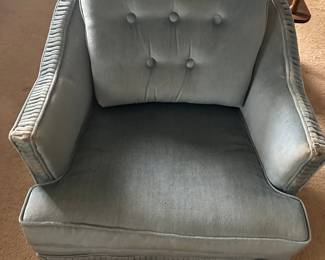 mid-century modern accent chair with tufted back and pleated armrests